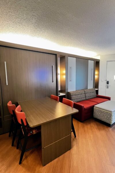 Disney resort suite with murphy bed, sofa bed, and dining table