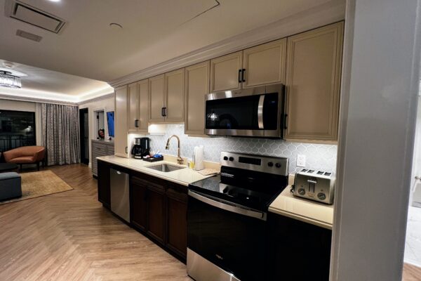 Modern DVC rental kitchen with stainless steel appliances and granite countertops.