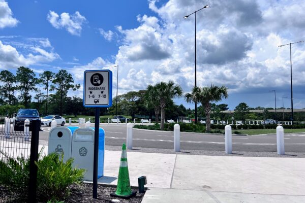 Disney rideshare pickup sign and waiting area for bachelorette weekend transportation.