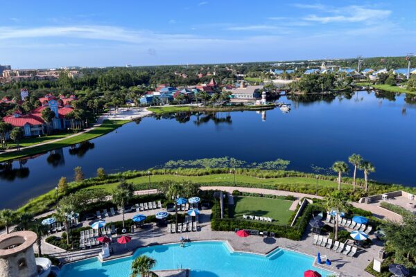 Resort pool and lake with DVC villas, perfect for group trips.