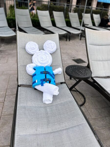 Mickey Mouse towel animal in life vest on Disney World pool chair
